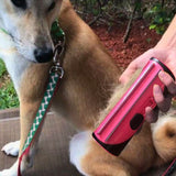 Showcasing a dog's hair removed by the Multipurpose Pet Hair Comb for Dogs and Cats